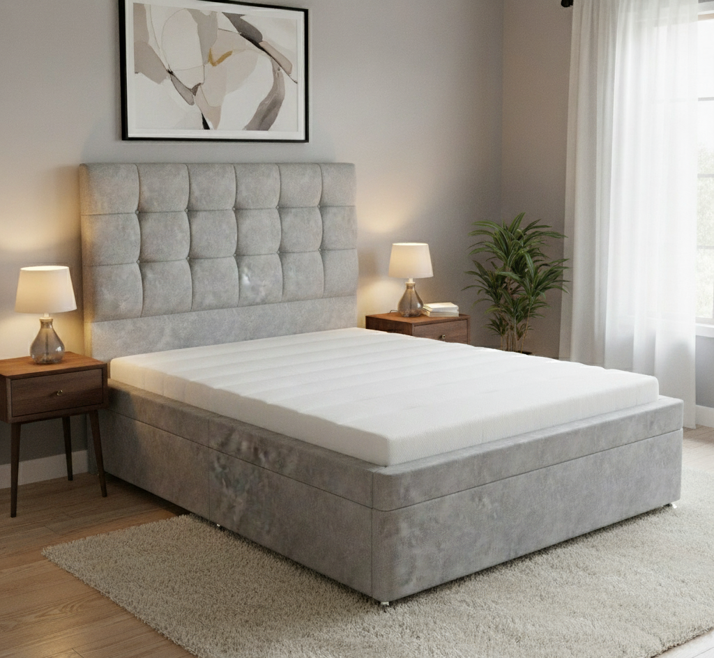 Gray upholstered bed with white mattress in a bedroom setting