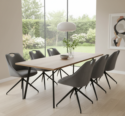 Modern dining room with a wooden table and gray chairs in a bright room with large windows.