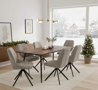 Dining room with wooden table and gray chairs in a modern interior setting.