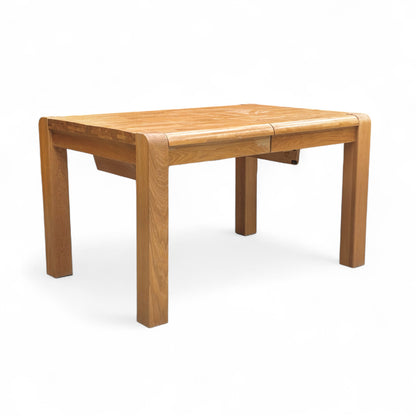 Full front view of the 'Bakerloo' Solid Oak Wooden Dining Table in its unextended, compact form.