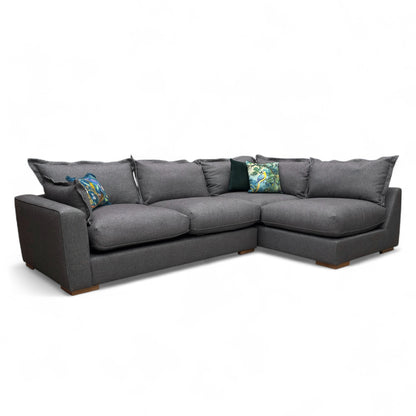 Full front view of the Sofology 'Gaia' Right Hand Facing Corner Sofa in charcoal grey tight weave fabric, showing its modern design and sloped armrests.