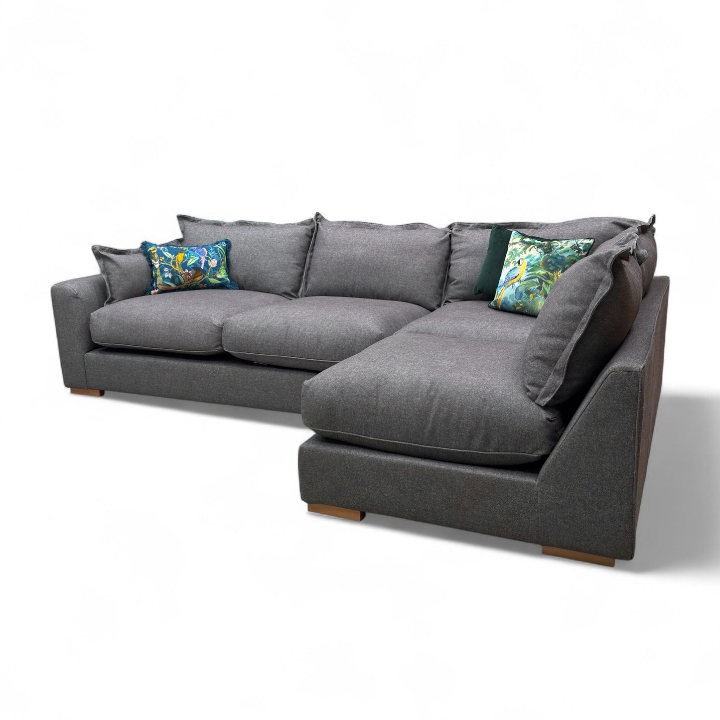 Side view of the 'Gaia' Charcoal Grey Corner Sofa, showing the overall height, depth, and low profile modern feet.