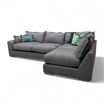 Side view of the 'Gaia' Charcoal Grey Corner Sofa, showing the overall height, depth, and low profile modern feet.