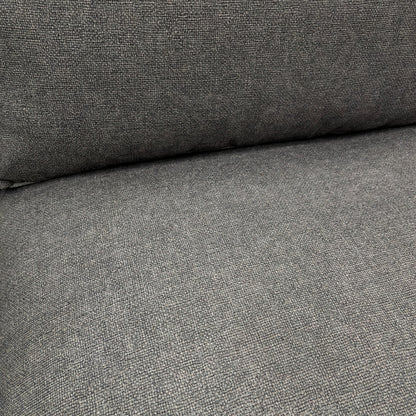 Close-up detail of the charcoal grey tight weave fabric on the 'Gaia' sofa, showing the texture and modern feel of the upholstery.