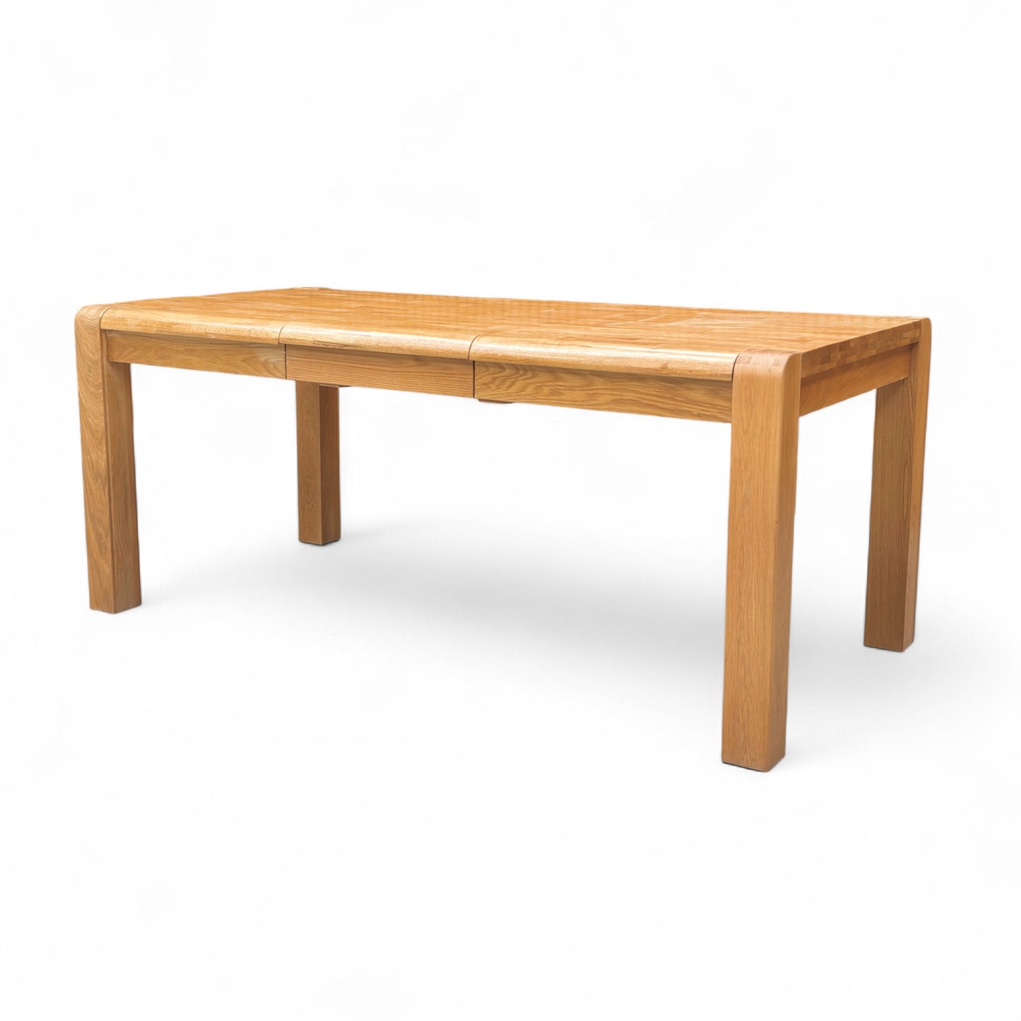 Detail shot of the rounded corner and simple, clean edge profile of the 'Bakerloo' Small Solid Oak Wooden Dining Table.