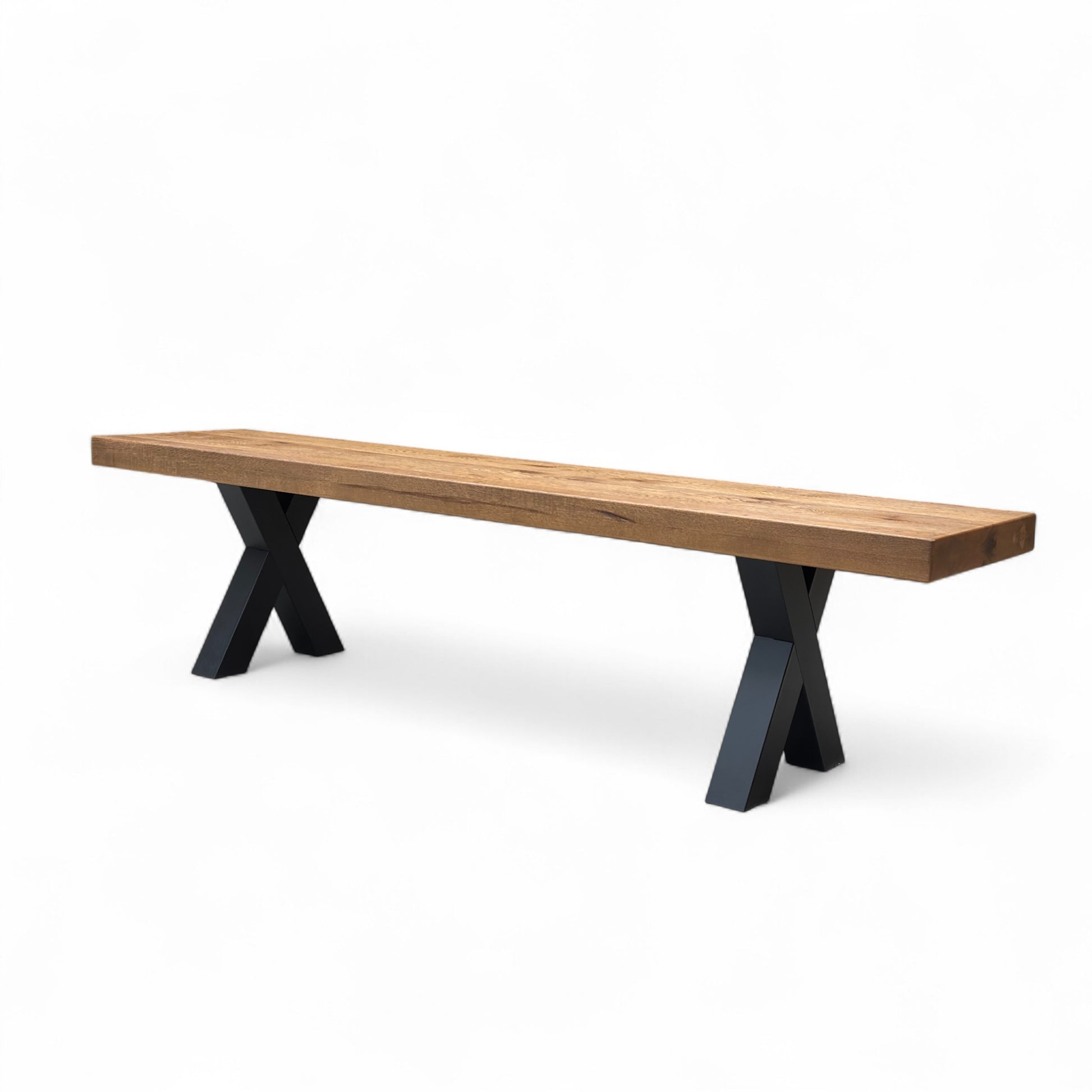 End-on perspective of the 180cm Solid Oak Bench, emphasizing the thick oak slab and the robust, chunky design.