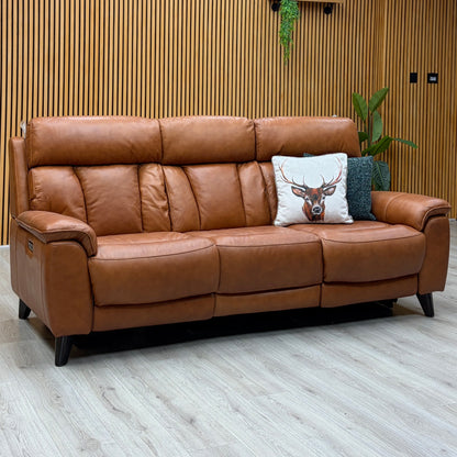 Dreamer saddle brown leather 3 seater sofa against a slatted wooden wall on a light oak floor