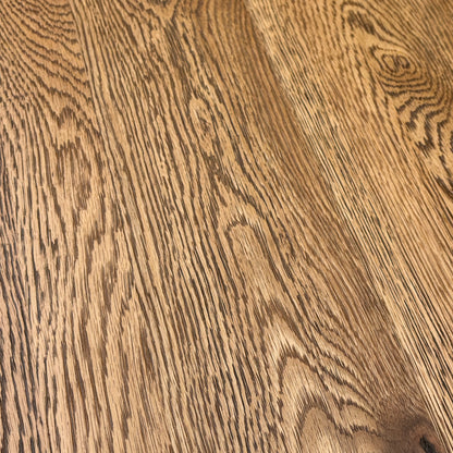 Close-up of the Desert Solid Oak seating surface, highlighting the natural grain, texture, and rustic finish of the wood.