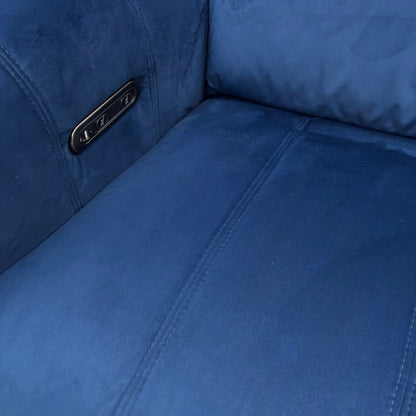Close-up view of the power recliner footrest in the fully extended position, showing the metallic base and stitching detail.