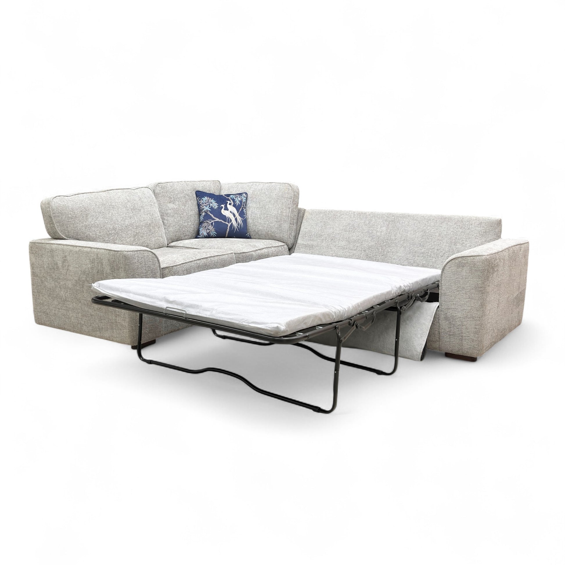 Full front view of the 'Emilia' Small Left Hand Facing Corner Sofa Bed in silver woven fabric, featuring a modern design and scatter cushions.