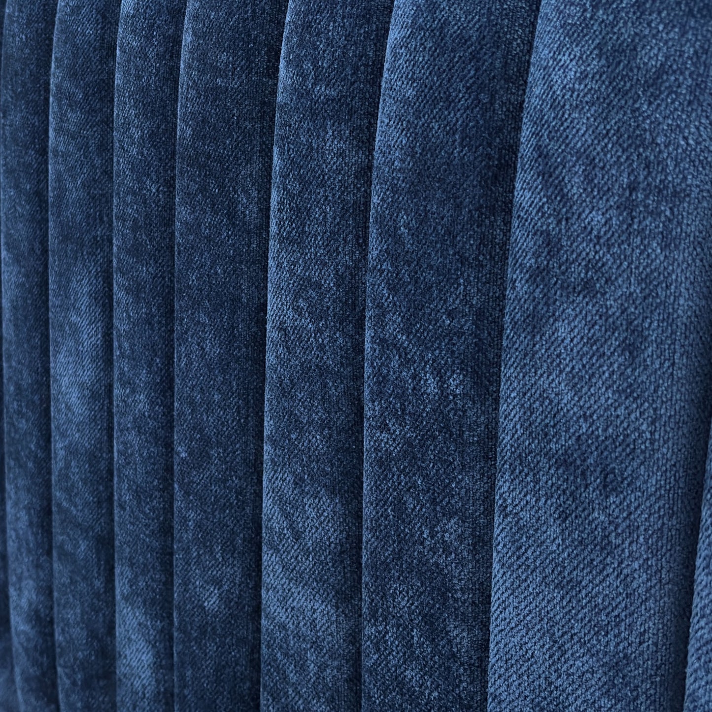 Close-up of the 'Portland' Floor Standing Headboard, showing the soft, textured sapphire blue fabric upholstery.