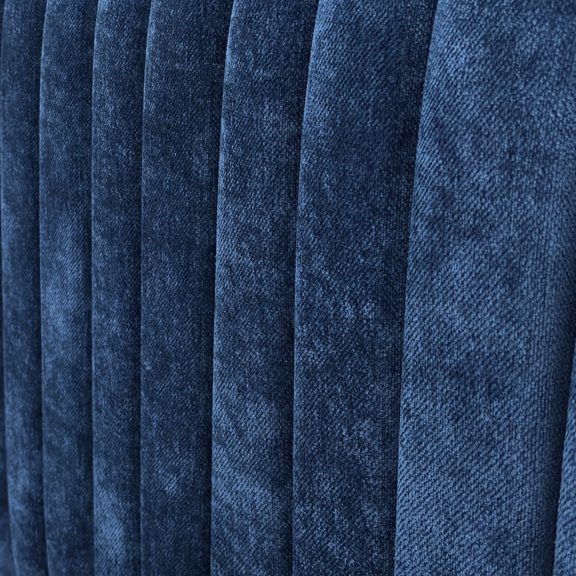 Close-up of the 'Portland' Floor Standing Headboard, showing the soft, textured sapphire blue fabric upholstery.
