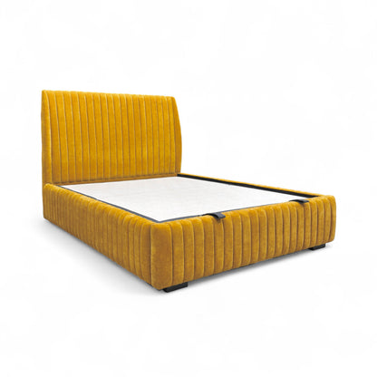 Detail shot of the end of the 'Aydon' bed frame, showing the edge and likely the handle/mechanism for the end lift ottoman function.