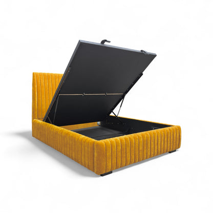 The King-size 'Aydon' End Lift Ottoman Bed open, showcasing the large, concealed storage space beneath the mattress base.