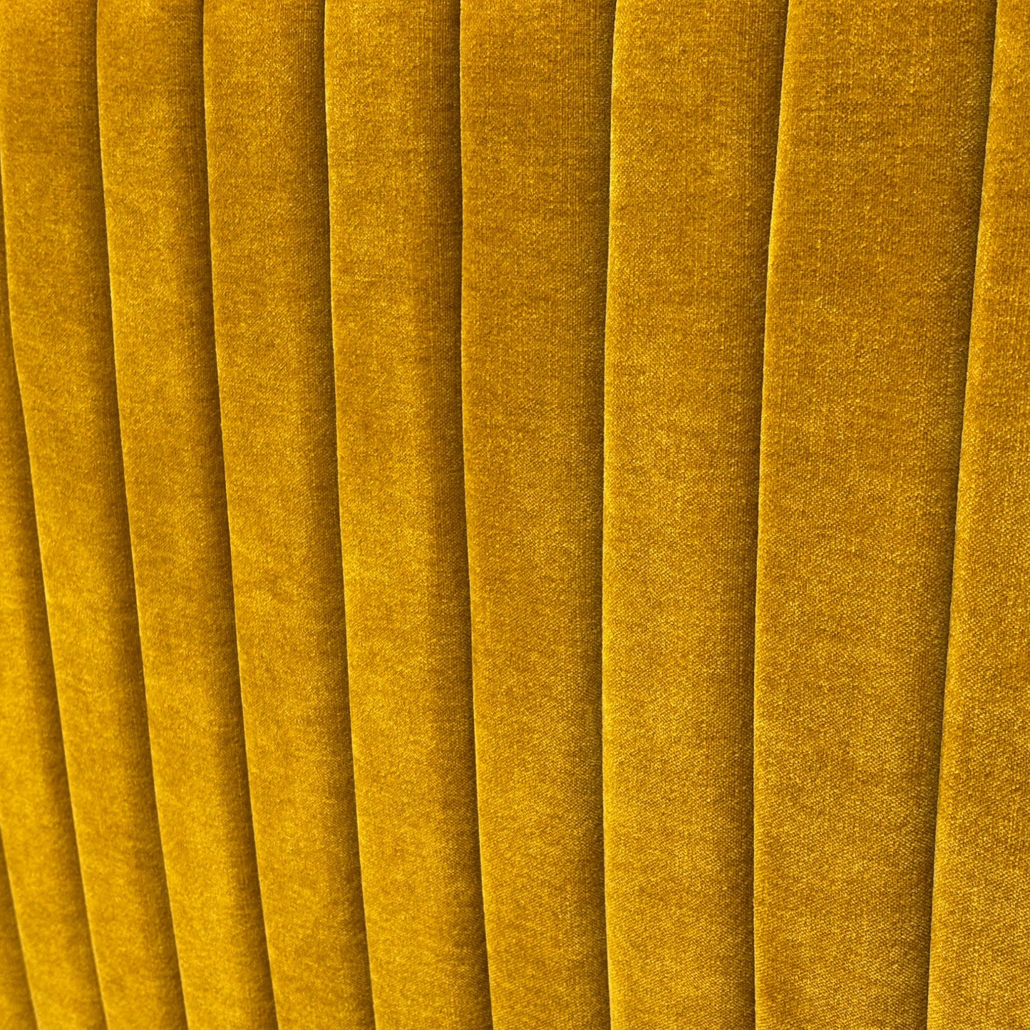 Close-up of the 'Aydon' Floor Standing Headboard, showing the saffron linen fabric and rectangular stitched panel design.