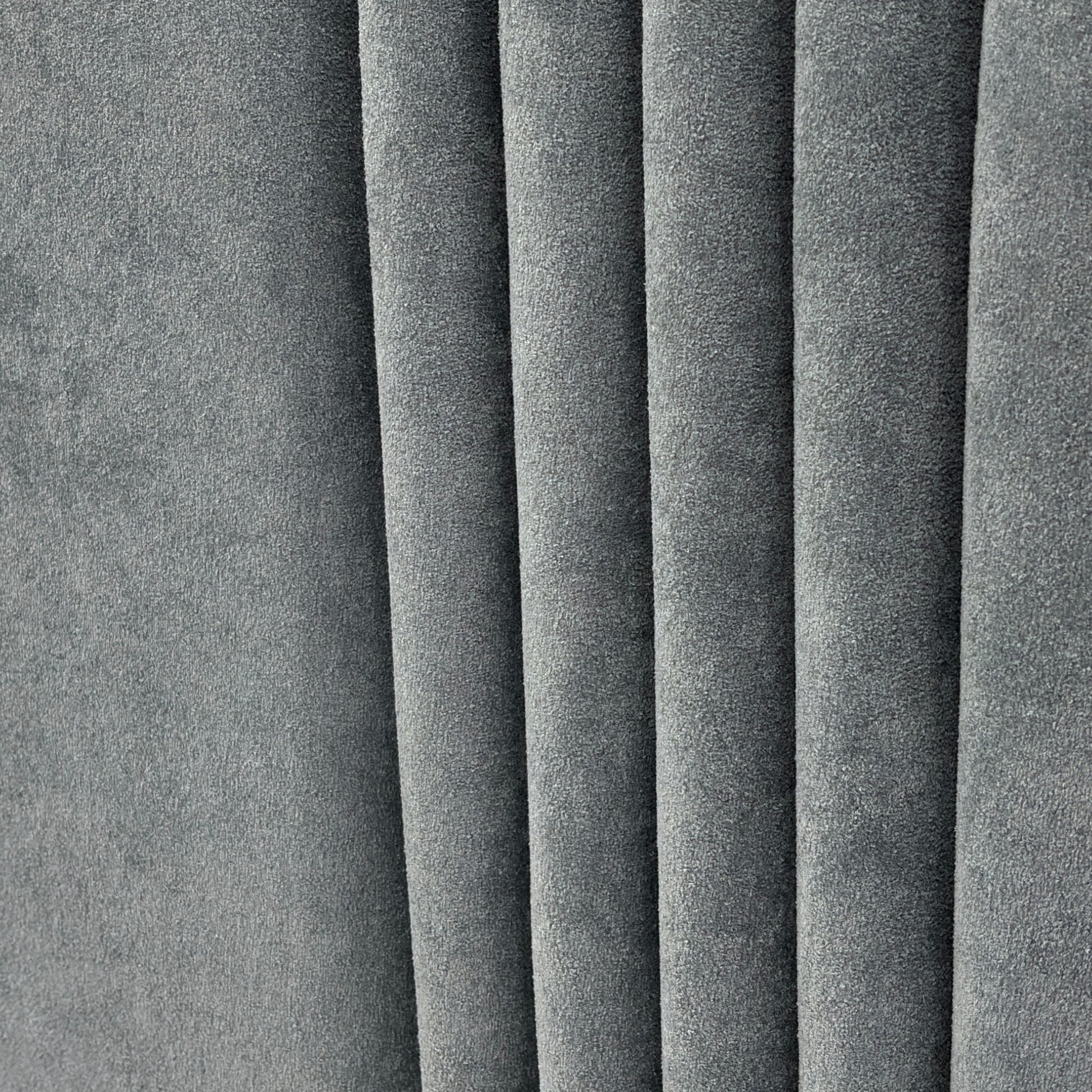 Close-up of the 'Oasis' Floor Standing Headboard, showcasing the deep vertical channel stitching and the sheen of the Milan Petrol Velvet fabric.