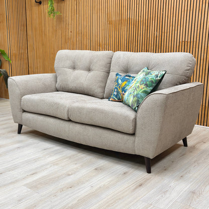 Lifestyle shot of the Dawson sofa in a modern living room, highlighting its generous seating and understated elegance.