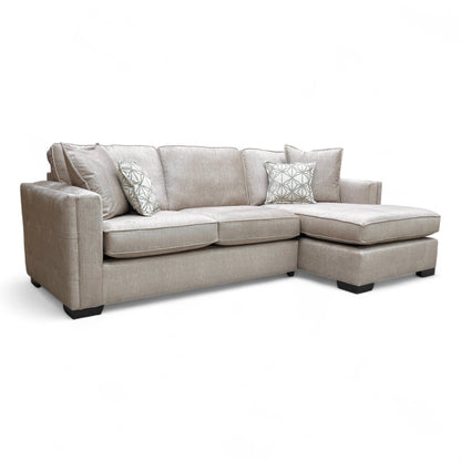 Full, straight-on view of the large 'Chelsea' right-hand facing open-end corner chaise sofa in beige velvet.