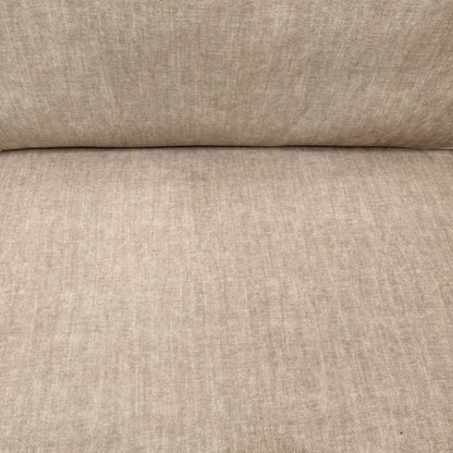 Close-up detail of the beige Vogue velvet upholstery on the 'Chelsea' sofa, showing the soft, textured fabric.