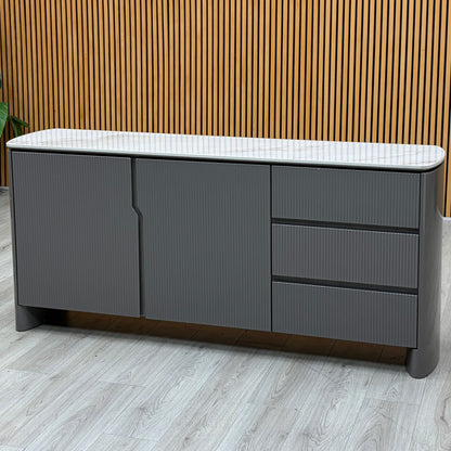 Ivy grey high gloss sideboard with white ceramic top against a slatted wooden wall on a grey wood-effect floor