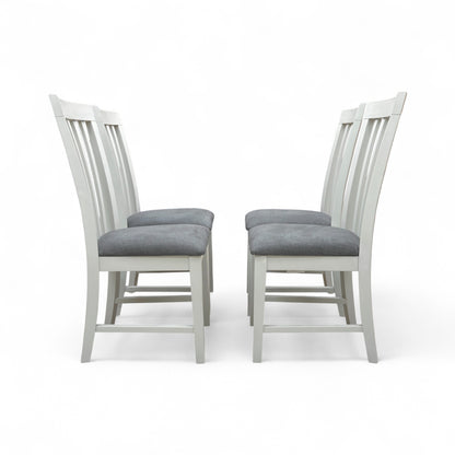 Angled view of the Hamilton grey wooden chair set, showing two chairs placed side-by-side, highlighting the craftsmanship and painted finish.