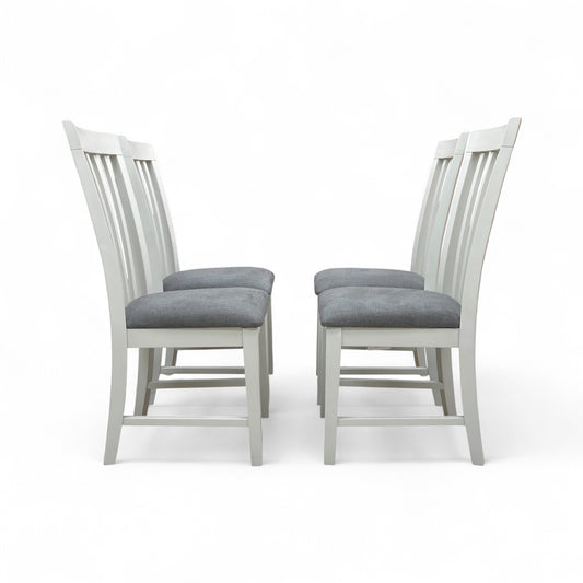Angled view of the Hamilton grey wooden chair set, showing two chairs placed side-by-side, highlighting the craftsmanship and painted finish.