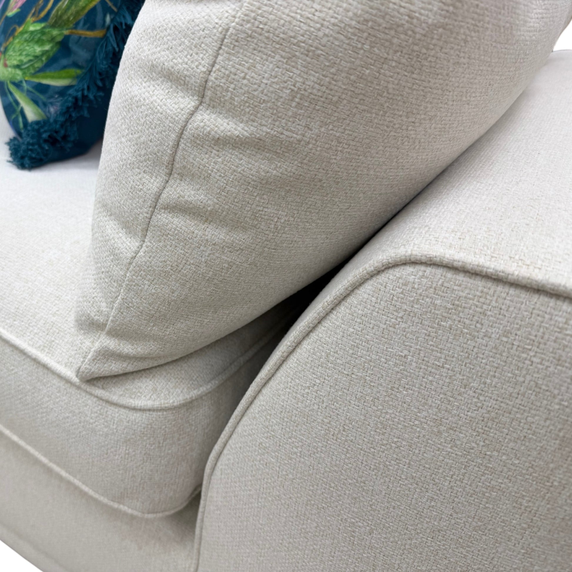 Close-up of the flared armrest and taupe Ashley fabric texture on the 'Dalton' sofa.