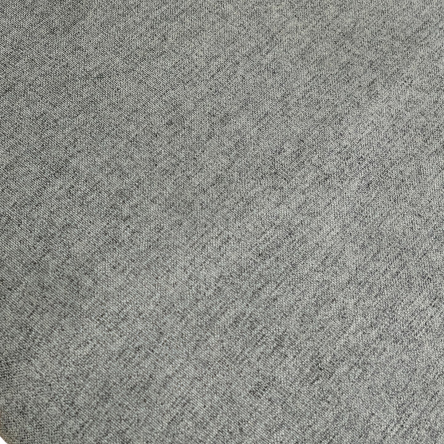 Close-up detail of the upholstered seat fabric and the junction with the dark wood frame on the 'Bakerloo' dining chair.