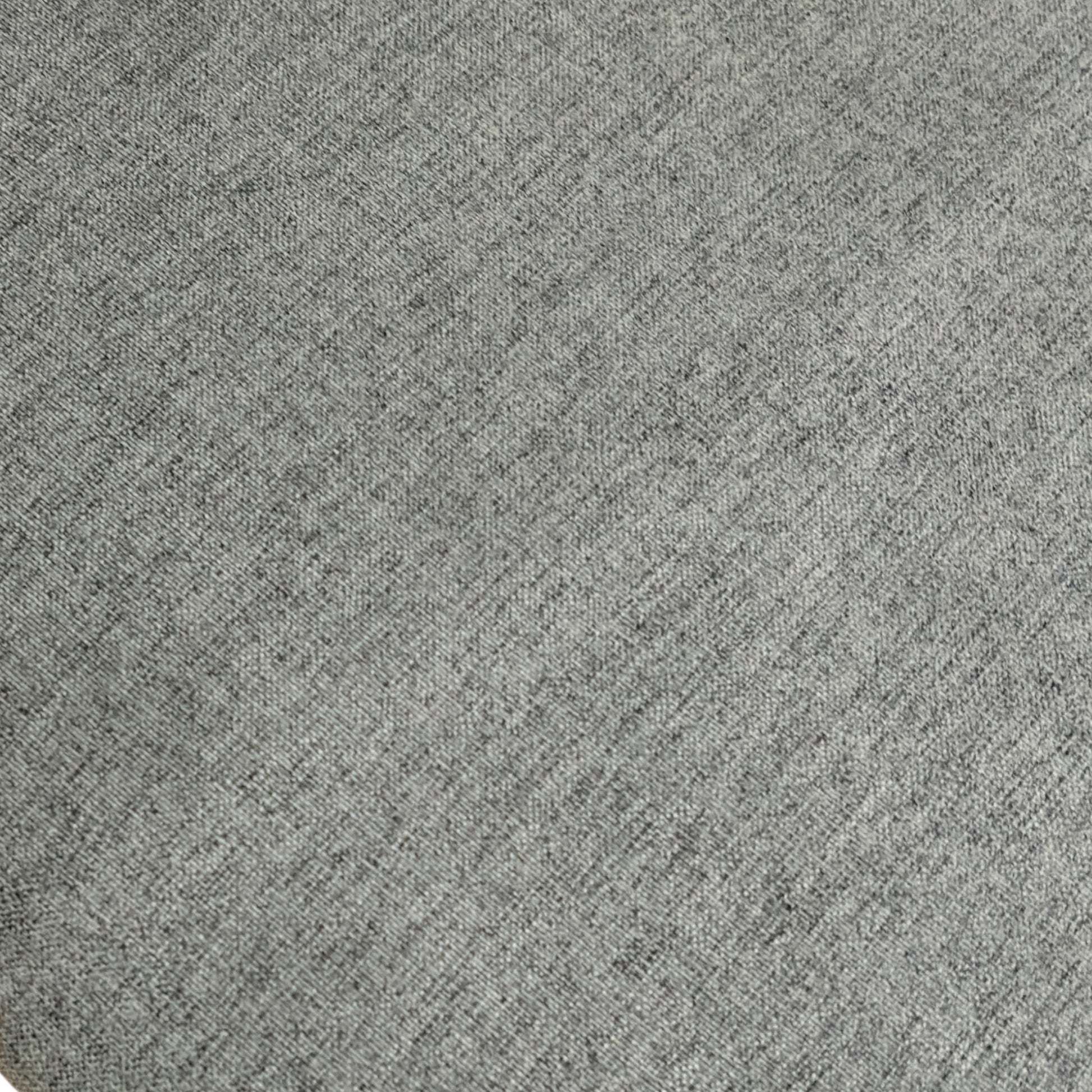 Close-up detail of the upholstered seat fabric and the junction with the dark wood frame on the 'Bakerloo' dining chair.