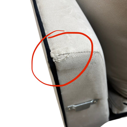Detail image showing the damage on the sofa, a specific condition note for this outlet product