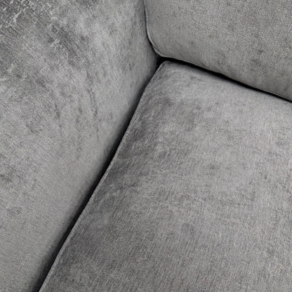 Close-up of the soft Shark Grey chenille fabric and cushion stitching on the 'Rosie' sofa.
