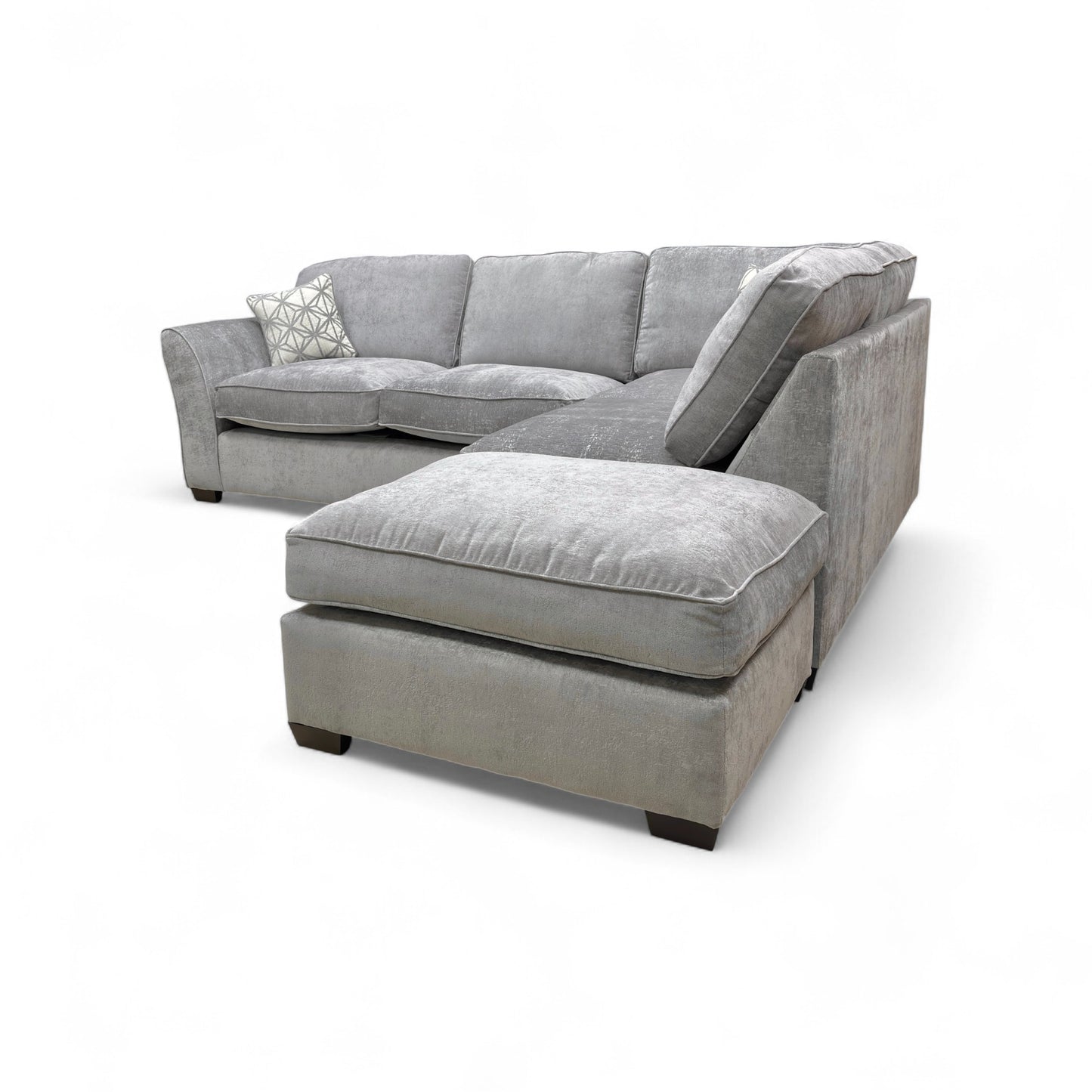 Detail shot showing the armrest, cushioning, and the contemporary wooden feet.