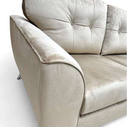 A close-up shot focusing on the Mink Velvet fabric texture, seat, and back cushions.