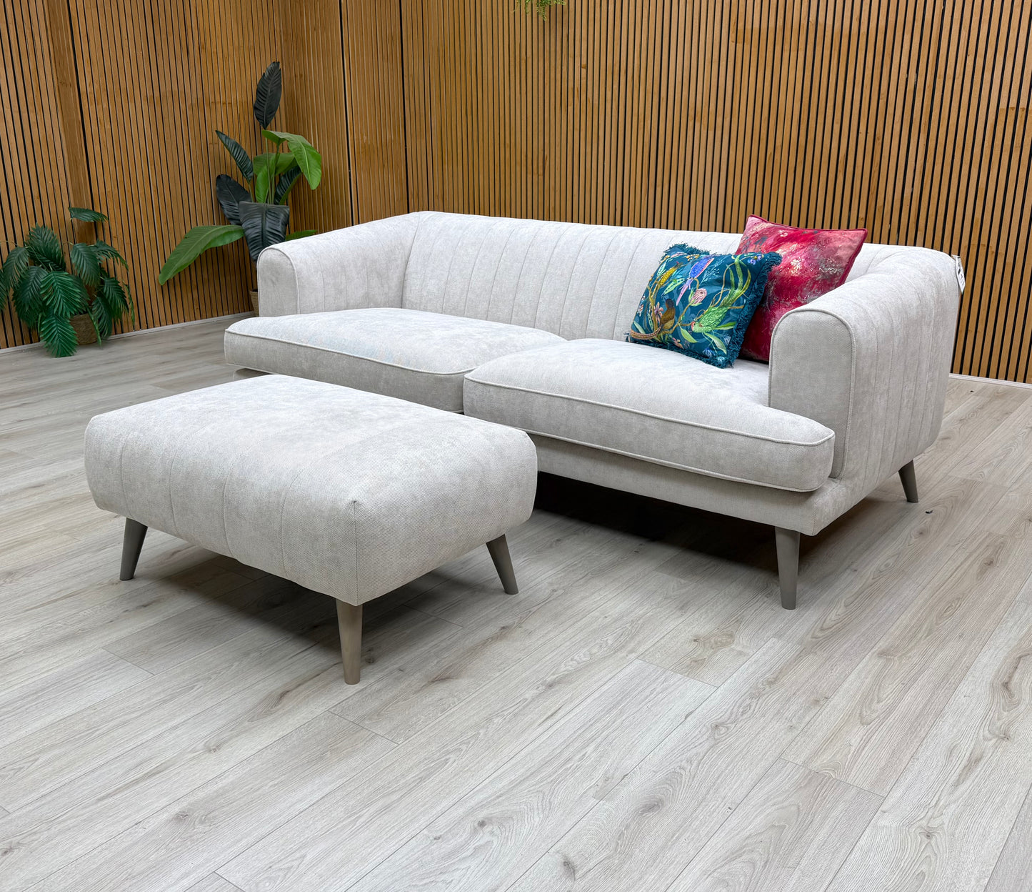 The sofa with an emphasis on its side profile or armrest design.