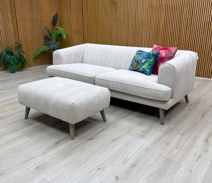 The sofa with an emphasis on its side profile or armrest design.