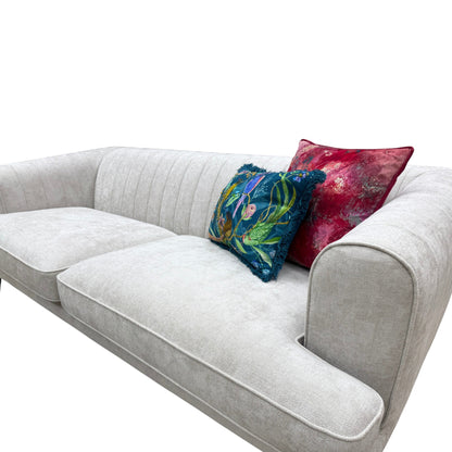 Close-up shot of the sofa's seating area, highlighting the taupe Catalina fabric and cushion texture.