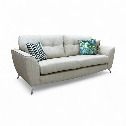 A view highlighting the sofa's high, structured backrest and the arrangement of the seat and back cushions.