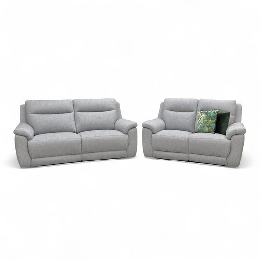 Front view of The 3 + 2 seater 'Bobby' Sofa with the left and right end seats fully reclined, showing the footrests extended.