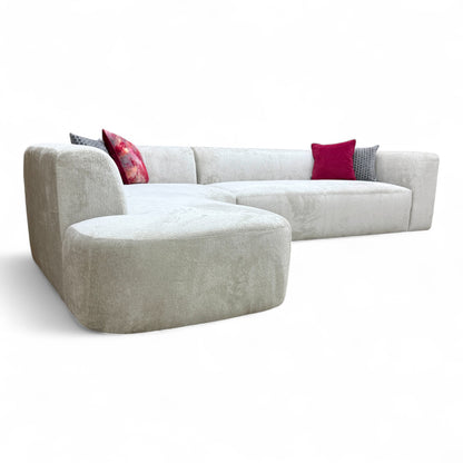 View of the open end of the left-hand facing chaise section, showing the finished side and depth of the seat.