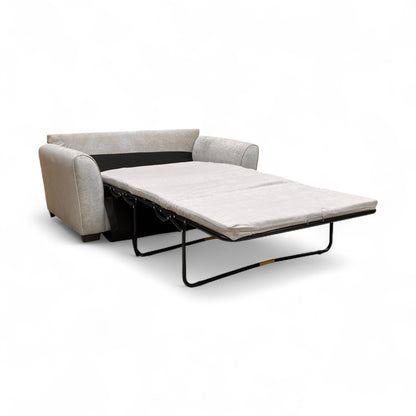 The ‘Julius’ Sofa Bed fully extended into the sleeping position, showing the pull-out metal frame and double-sized mattress.
