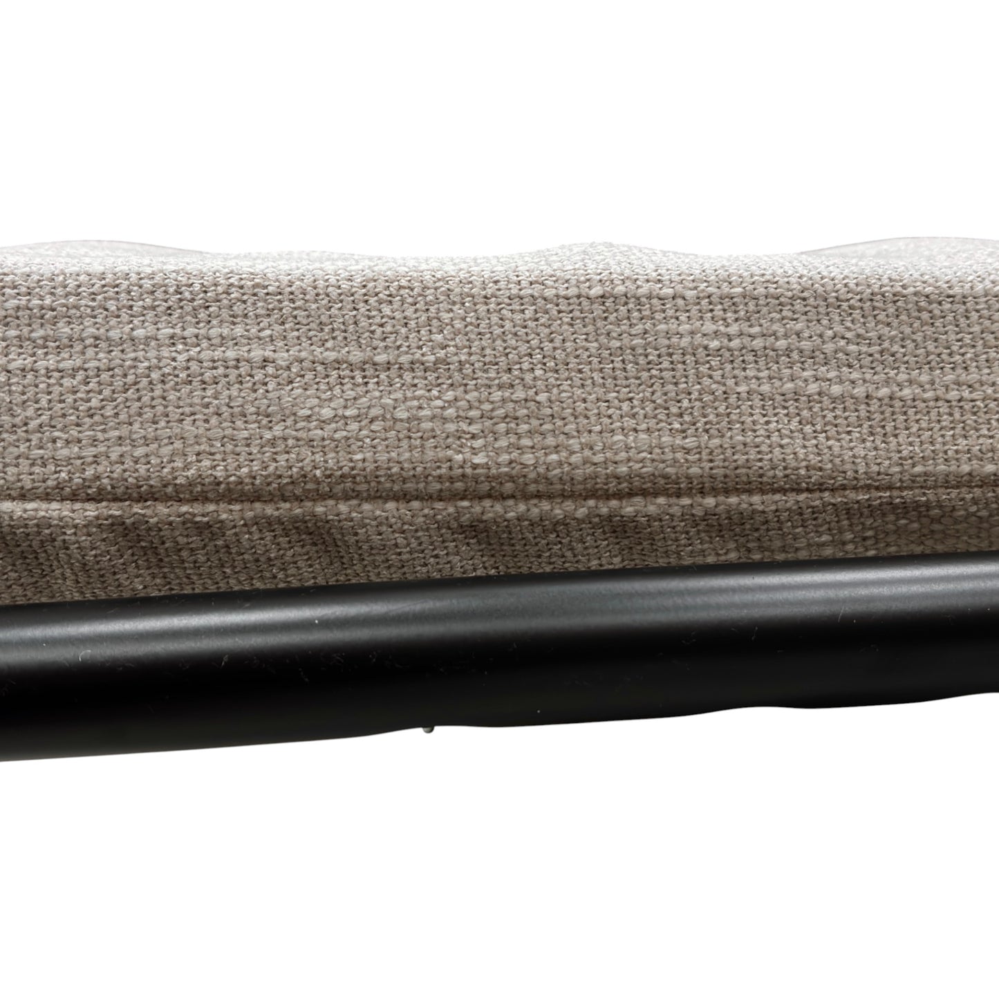 Close-up of the fully extended sofa bed mattress and the exposed metal support frame.