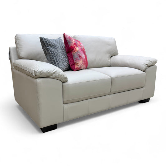 Fabb 'Hofman' 2 Seater Sofa in modern light grey leather, shown from an angle, highlighting its compact, contemporary design.