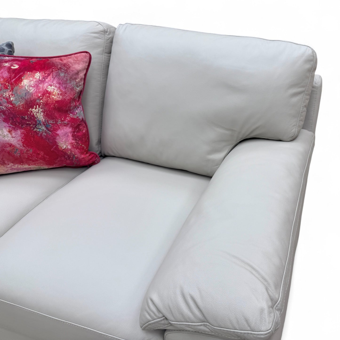 Close-up shot of the light grey leather upholstery, cushion stitching, and texture of the 'Hofman' 2 Seater Sofa.