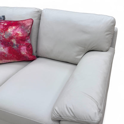 Close-up shot of the light grey leather upholstery, cushion stitching, and texture of the 'Hofman' 2 Seater Sofa.