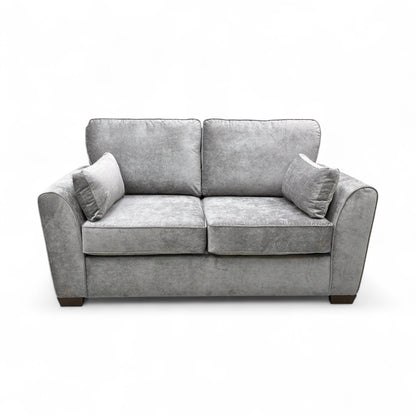 Frontal view of the ‘Julius’ Grey Fabric Sofa, emphasizing the size, armrests, and foam-filled seat cushions.