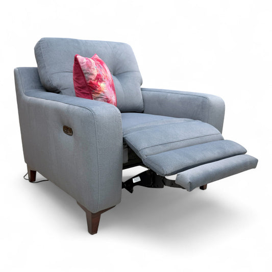 Full View profile of the 'Iris' armchair, emphasizing the clean lines and steel grey velvet upholstery.