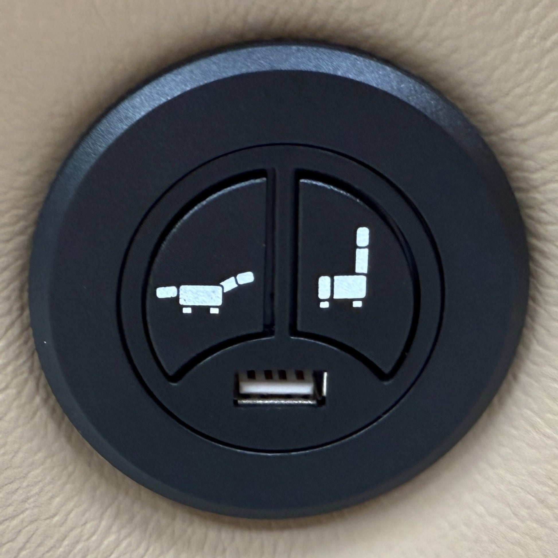 Close-up of the side of the 'Francis' sofa, showing the power recliner control buttons and integrated USB charging port.