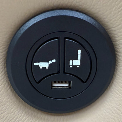 Close-up of the side of the 'Francis' sofa, showing the power recliner control buttons and integrated USB charging port.
