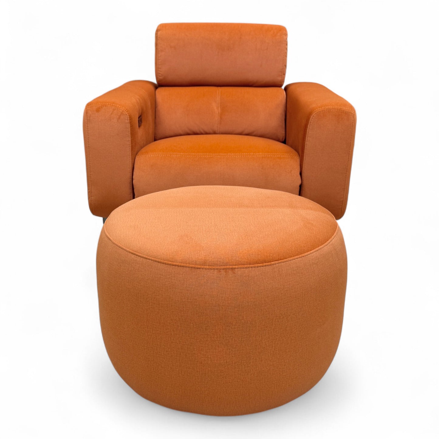 Front view of the 'Ezra' rust orange velvet recliner chair and coordinating round footstool.