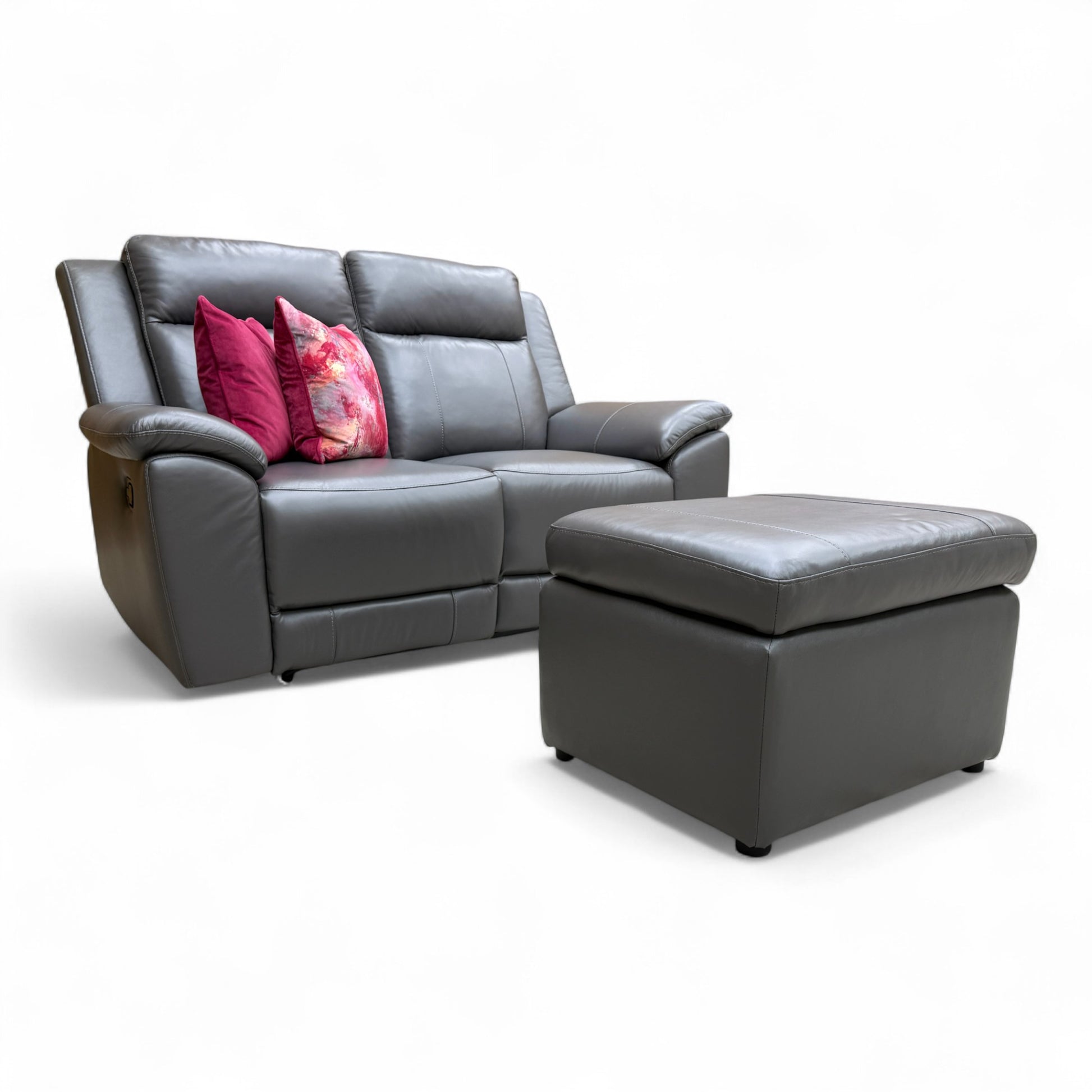 Angled view of the Fabb 'Maverick' 2-seater manual recliner sofa and storage footstool in elephant grey leather, showcasing both items.